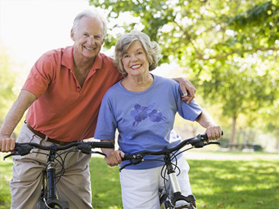 Older couple on a bike