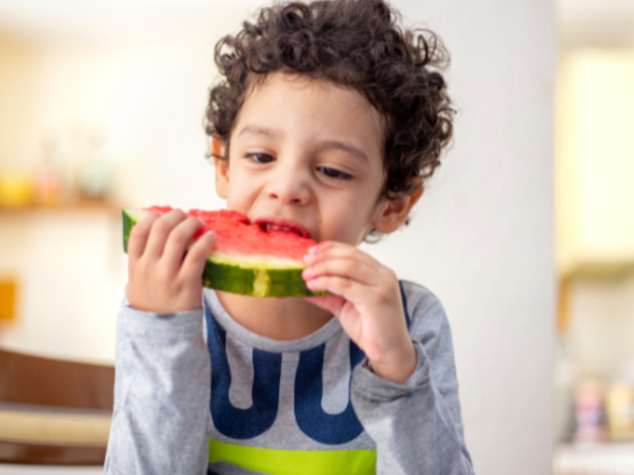 kid eating watermelon