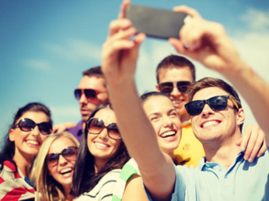 People in sunglasses taking a selfie