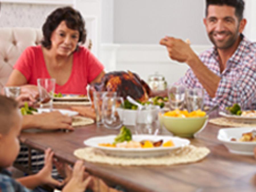 Family enjoying meal at table