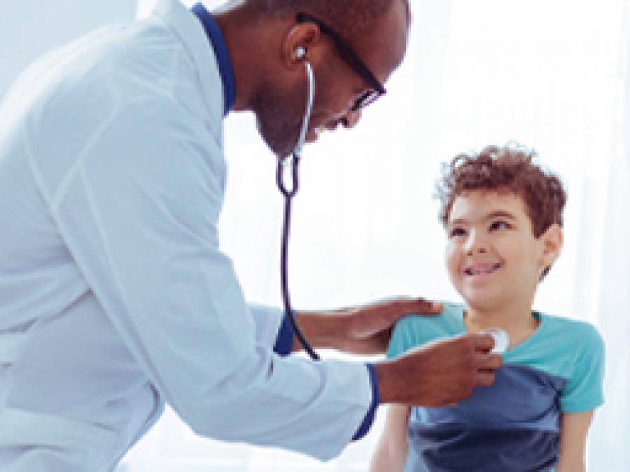 Doctor listening to a child's chest